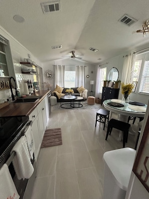 A beautiful kitchen and spacious area living room area, all in new renovated