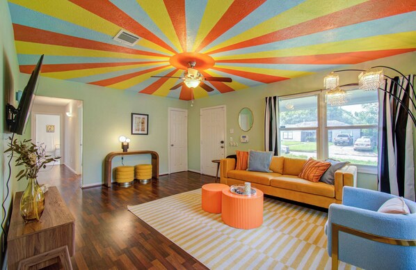 Vibrant living room with colorful ceiling