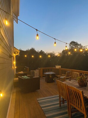 large deck with fire pit .
