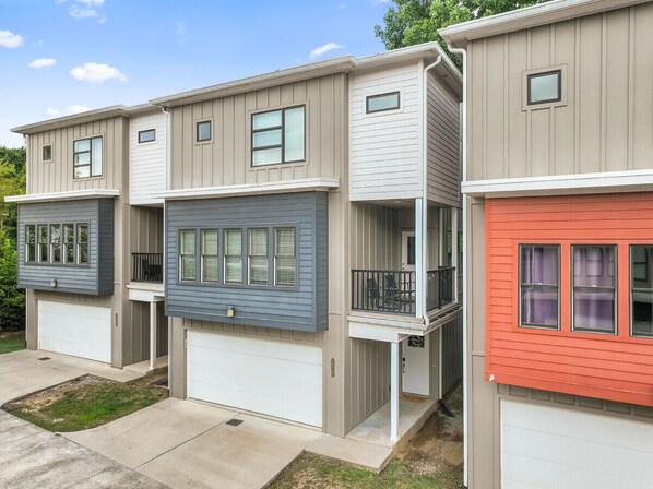 Front of House – Modern townhouse with a private balcony and garage.
