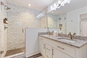 🛁 Spa-like bathroom with a walk-in shower and double vanity.