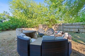 Backyard with outdoor furniture and fire pit