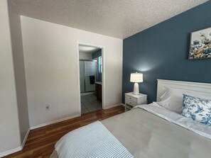 View from primary bedroom into on suite bathroom & walk-in closet