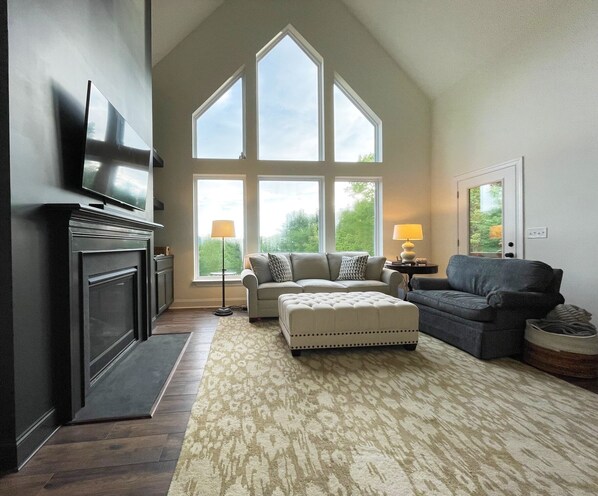 Living room with treetop long range views