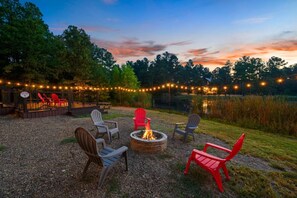 Starlit skies and crackling fires—our cabin’s firepit is the heart of cozy nights and great conversations.