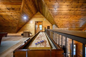 Score big on relaxation and fun—our shuffleboard table adds a touch of excitement to your cabin stay.