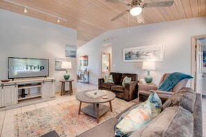The living room offers plush, comfy seating, perfect for relaxing after a day of adventure or gathering for a cozy evening indoors.