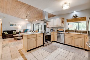 The kitchen features plenty of counter space, making it easy to prepare and serve meals while staying connected with family and friends.