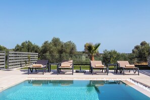 Find your oasis of calm by the shimmering pool waters.
