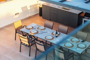 Gather around the outdoor table for unforgettable dining experiences.