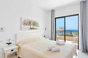Bedroom with Queen Bed, Flatscreen TV, Wardrobe and Balcony Access