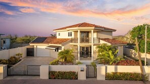 Your Private Oasis Awaits – This stunning villa in Malmok, Aruba, is framed by picturesque hills and a serene nature reserve