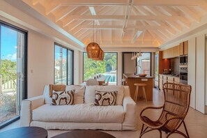 Air-conditioning, large HD-TV with Dish Network, Apple TV, iPod dock. The living room opens onto the terrace. 