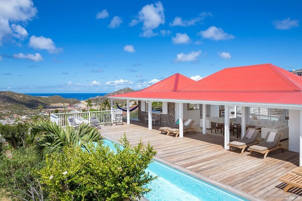 Nice pool, sunny expansive terrace with loungers and deckchairs.