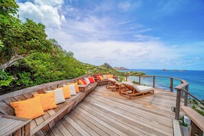 Private lounge area on the pool level with panoramic views over the bay. 