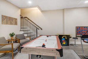Get ready for endless fun in our fully-loaded game room! Challenge your friends to shuffleboard, foosball, skeeball, or a round of Pac-Man. Shoot some hoops with Pop-A-Shot, show off your skills in ping pong and air hockey, or enjoy classic games like Connect Four, Tic-Tac-Toe, and ring toss. Plus, scale new heights on our climbing wall and dive into 30,000 retro video games wi...