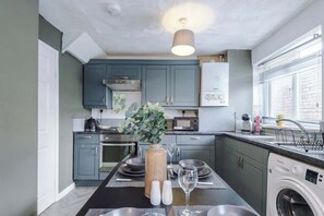 The fully equipped kitchen has everything you need for a long or short stay in Stalybridge.