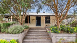 Avalon- front entrance with full length undercover veranda and outdoor table and chairs. 