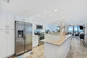 Fully updated kitchen. Wonderful flow from the kitchen to the dining area, living area, and balcony.