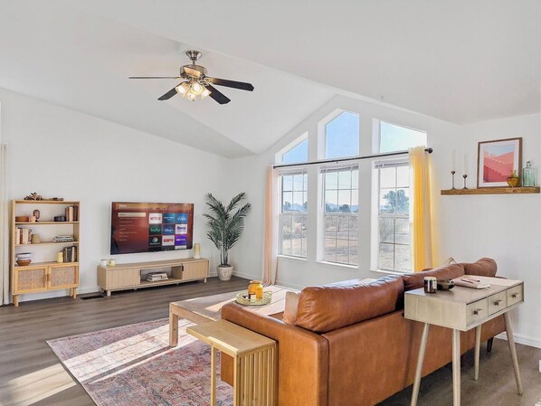 Our instagram-worthy Airbnb is designed for comfort and connection. Sink into plush seating, enjoy your favorite shows on the flat-screen TV, and make memories with loved ones in this warm, inviting space.