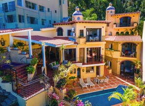 Exterior view of villa offering complete privacy, ocean & Los Arcos views.