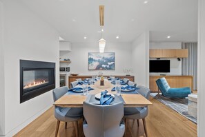 Enjoy Bose surround sound and a cozy fireplace at your inviting dining table.