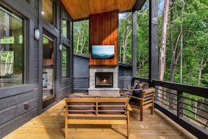 A view of the porch featuring comfortable seating areas.