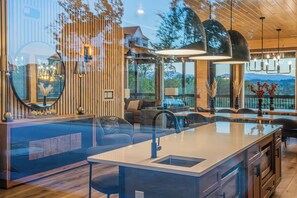 Step into a stunning entryway featuring a striking accent wall that sets the tone for the luxurious design throughout the cabin.