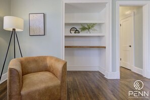 Settle into a cozy corner with soft lighting and a comfy chair—perfect for unwinding with a book or enjoying a quiet moment.