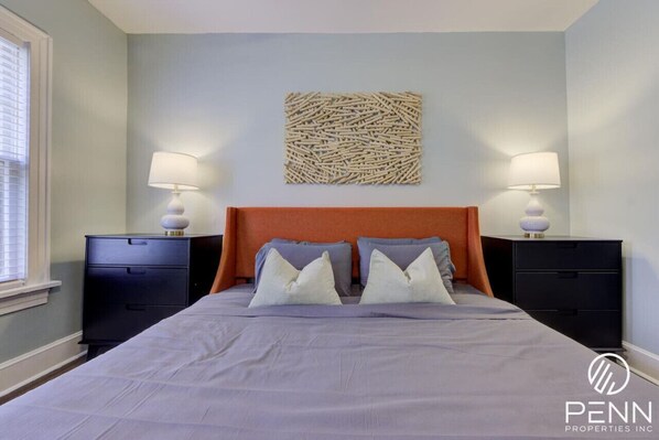 Sleep deeply in comfort surrounded by calming decor and cozy bedside lighting, setting the perfect mood for restful nights.