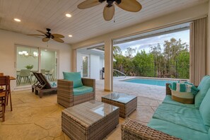 Backyard oasis with a pool, hot tub, patio, and outdoor seating.