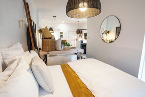 Open plan bedroom with cabinetry between for your cases and personal items