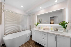 Primary bathroom includes a soaking tub, dual sinks and a large walk-in shower