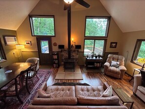Living room is so cozy and comfortable with a wood-burning stove!