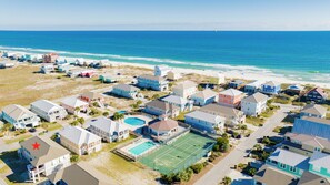 Community pools, tennis,pickleball and steps to the beach