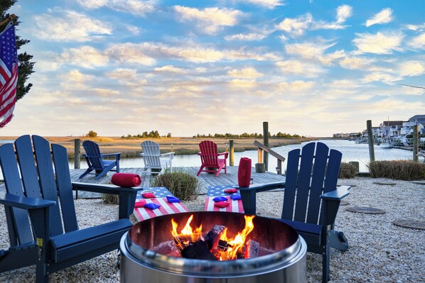 Brand new fire pit, Adirondack chairs, corn hole set!
