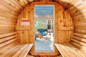 Indulge in pure relaxation within our cedar barrel sauna.