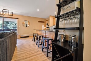 Breakfast bar, wine glasses and bar accessories.
