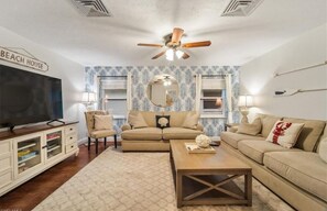 Family Room, stocked with games, puzzles, large flat screen and work space. 