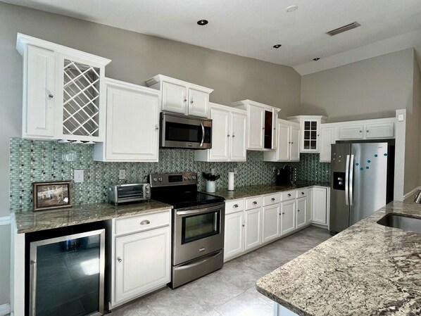 Large fully-stocked kitchen with island!