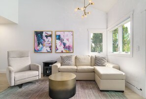 The living room couch can pullout to sleep 2.
