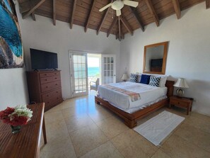 Primary bedroom with balcony.