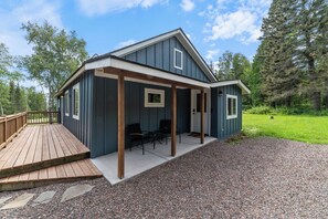 Space to enjoy your morning coffee. During winter months, a structure to store your skis will be added to the covered porch. 