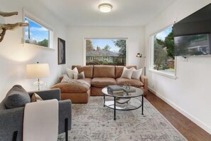 Living area with large Roku television to relax and unwind
