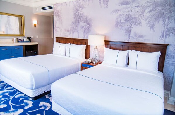 Comfortable double beds in a beautifully decorated room.