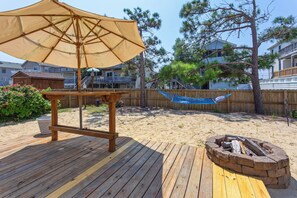 The Outdoor Entertainment Area with a firepit is the ideal spot to soak up the sun and have some fun!