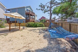 The Outdoor Entertainment Area with a firepit is the ideal spot to soak up the sun and have some fun!