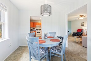 Eat together in the brightly lit Dining Area with welcoming views and comfortable seating.