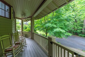 Enjoy your morning coffee on the covered front porch while taking in the seasonal views and sounds of the neighborhood.