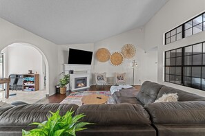 Kick back on the sofa, catch up on your favorite shows on the smart TV, or simply enjoy the company of friends and family in this inviting space.
